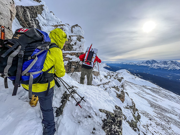 Ascending the crux outcrop on the south ridge.