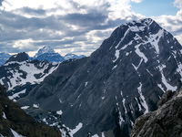 The view back over Pig's Tail / Commonwealth col includes Smuts (L) Smutwood and Assiniboine in the distance.