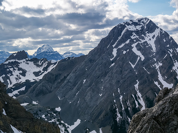 The view back over Pig's Tail / Commonwealth col includes Smuts (L) Smutwood and Assiniboine in the distance.