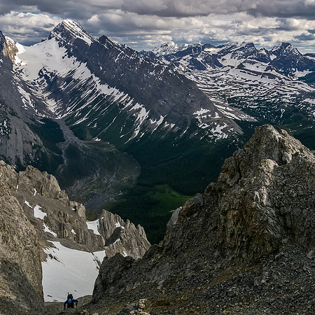Keith grovels up the steep scree gully before the crux.