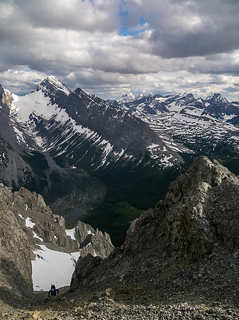 Keith grovels up the steep scree gully before the crux.