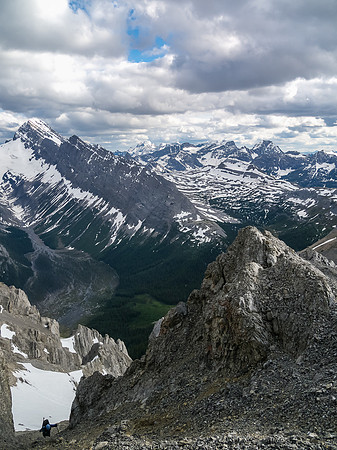 Keith grovels up the steep scree gully before the crux.