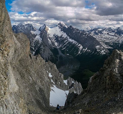 Keith grovels up the steep scree gully before the crux.