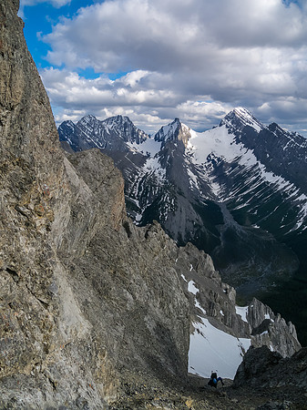 Keith grovels up the steep scree gully before the crux.