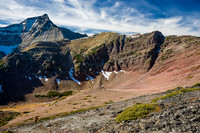 Wietse climbs above the hanging valley with Mount Alderson in the background.