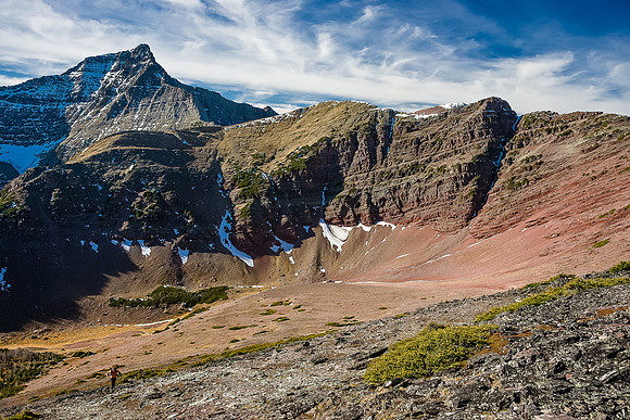 Wietse climbs above the hanging valley with Mount Alderson in the background.