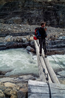 Raf crosses a raging Peyto Creek on a bridge that's no longer there (2019).