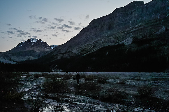 A last photo looking back at Peyto Peak (L) and Caldron Peak (R) before complete darkness settles in as we cross the Peyto Lake flats.