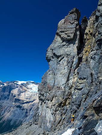 JW retraces our steps along the summit block's west cliff face.