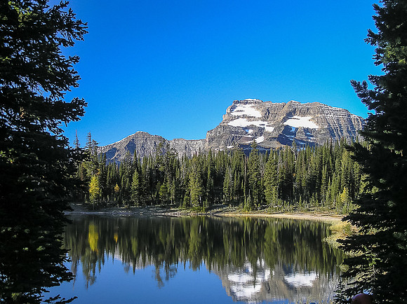 Summit Lake reflects a beautiful morning view as we make our way up to the Carthew - Alderson col.