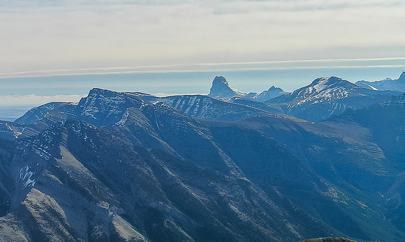 Looking past Sofa Mountain (L) towards a distant Chief Mountain.