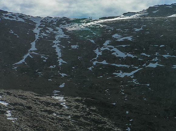 Bob and Frank are apparent on the ridge of Mount Alderson from below the descent route.