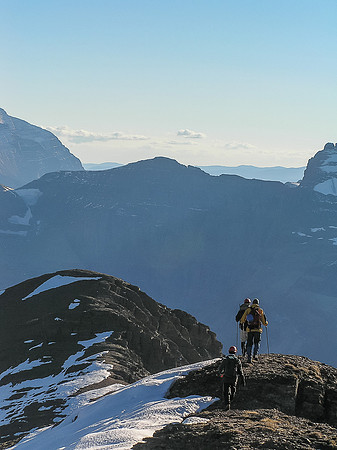 The group descends off the summit of Mount Carthew.