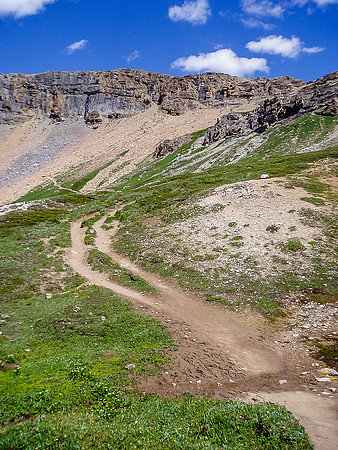 The trail around the lake heading up to the shoulder.