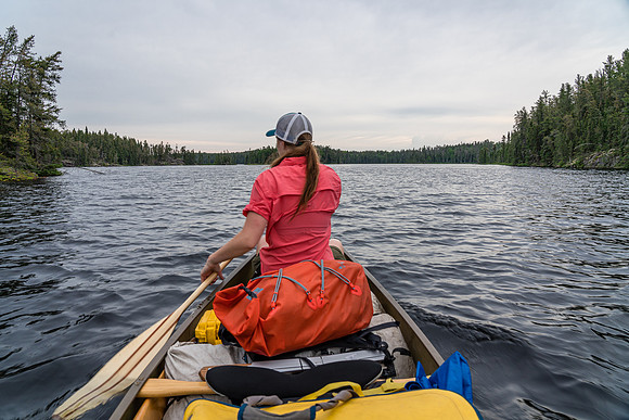 Sunday dawns gray and humid. Paddling out of Page Lake.