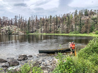 Portaging from Royd Lake to Kennedy Lake along Royd Creek.