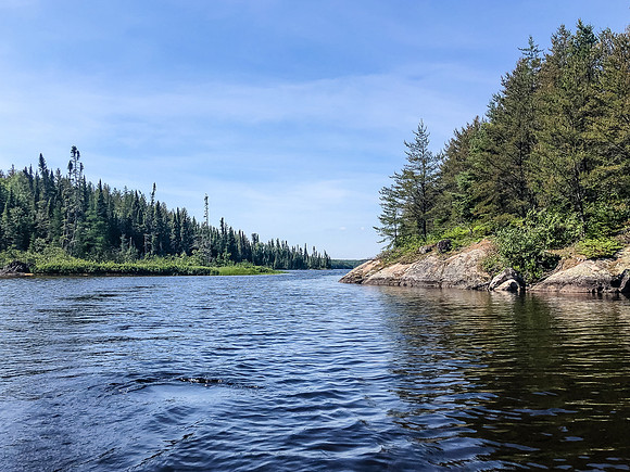 Paddling the Rostoul River through Optic Lake.