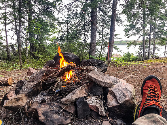 Huddling under the tarp during a rainstorm on Telescope Lake.