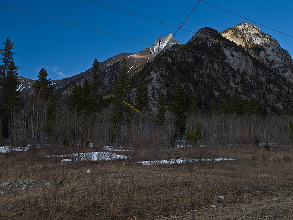Looking back at the summit from the power line road before re-crossing the Kananaskis River.