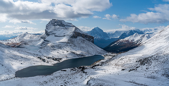 Hiking up Packers Pass Peak. Views back over Ptarmigan Lake to Redoubt Mountain.