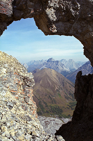 Pocaterra Ridge is perfectly framed through the infamous 'window' in the ridge to the summit of Tyrwhitt.
