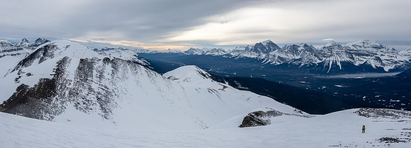 Skiing up wind hammered snow on the south ridge. Hector South Ridge at left.