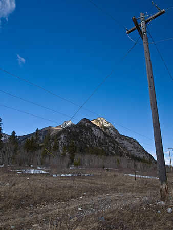 Looking back at the summit from the power line road before re-crossing the Kananaskis River.