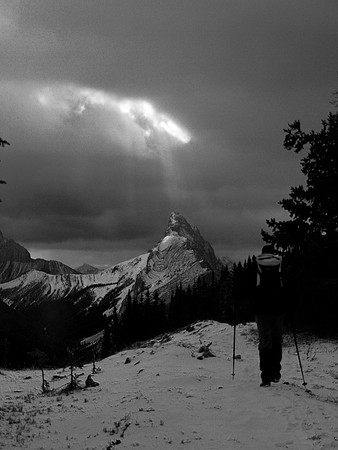 A shaft of light gets the summit of Mount Wintour.