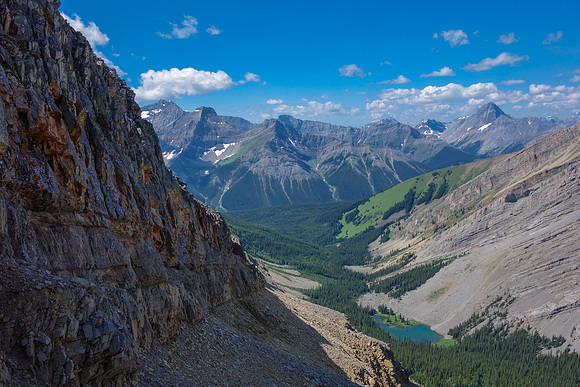 I traversed ledges and scree ramps back and forth on the west face with gorgeous views of the James Walker Tarn below.