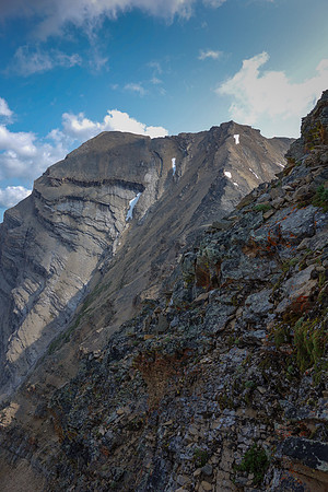 You can see the steepness and looseness of the terrain here, looking at the twin summits of Inflexible as I near the col, side-slopping on climber's left.