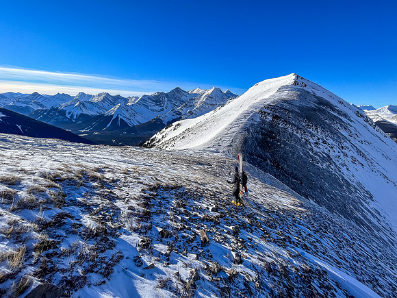 Bootpacking up the last of the skiable terrain.
