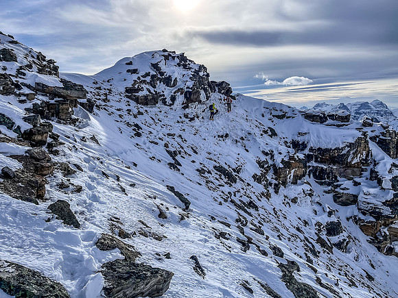 Returning in high winds along the south ridge.