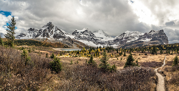 Mount Assiniboine area comes into view with The Towers, Naiset Point, Terrapin, Magog, Assiniboine, Wedgewood and Sunburst Peaks on the horizon (L to R).