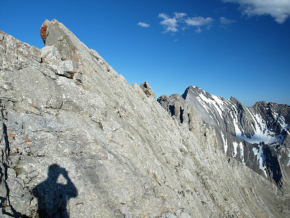 Heading back along the summit ridge.