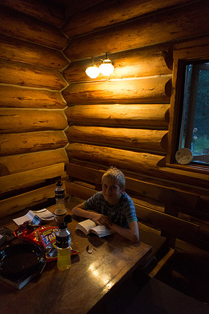 The Elk Lakes ACC Hut is cozy at night.