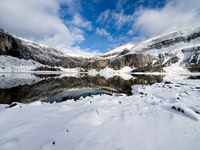 One more wide-angle shot of Rockbound Lake with some blue sky and fresh snow.