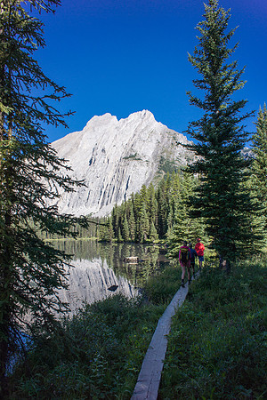 Mount Fox rises over us as we traverse the shoreline of the lower lake.