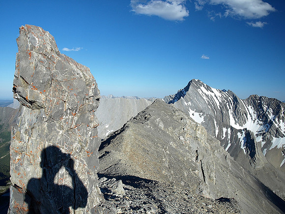 Heading back along the summit ridge - Storm Mountain on the right.