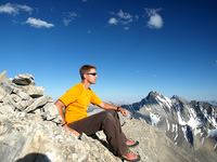 Vern on the summit with Storm Mountain to the south.