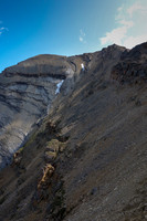 Side slopping towards the col - avoiding obvious rotten cliff bands.