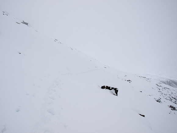 Descending a snowy mountain.