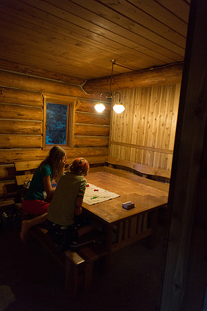 The Elk Lakes ACC Hut is cozy at night.