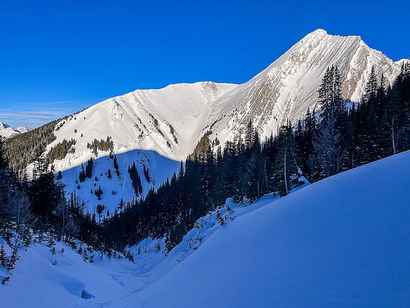 Skiing up the NW access drainage. View back to Mount Chester.