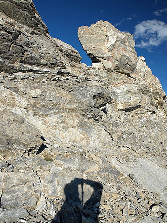 Heading back along the summit ridge.