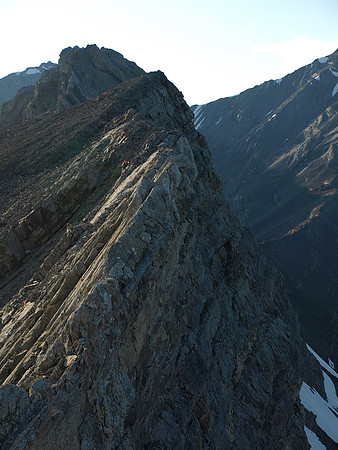 From the top of the crux - that I've just re-climbed - you can see that the terrain to the summit isn't easy - Wietse is carefully down climbing it.